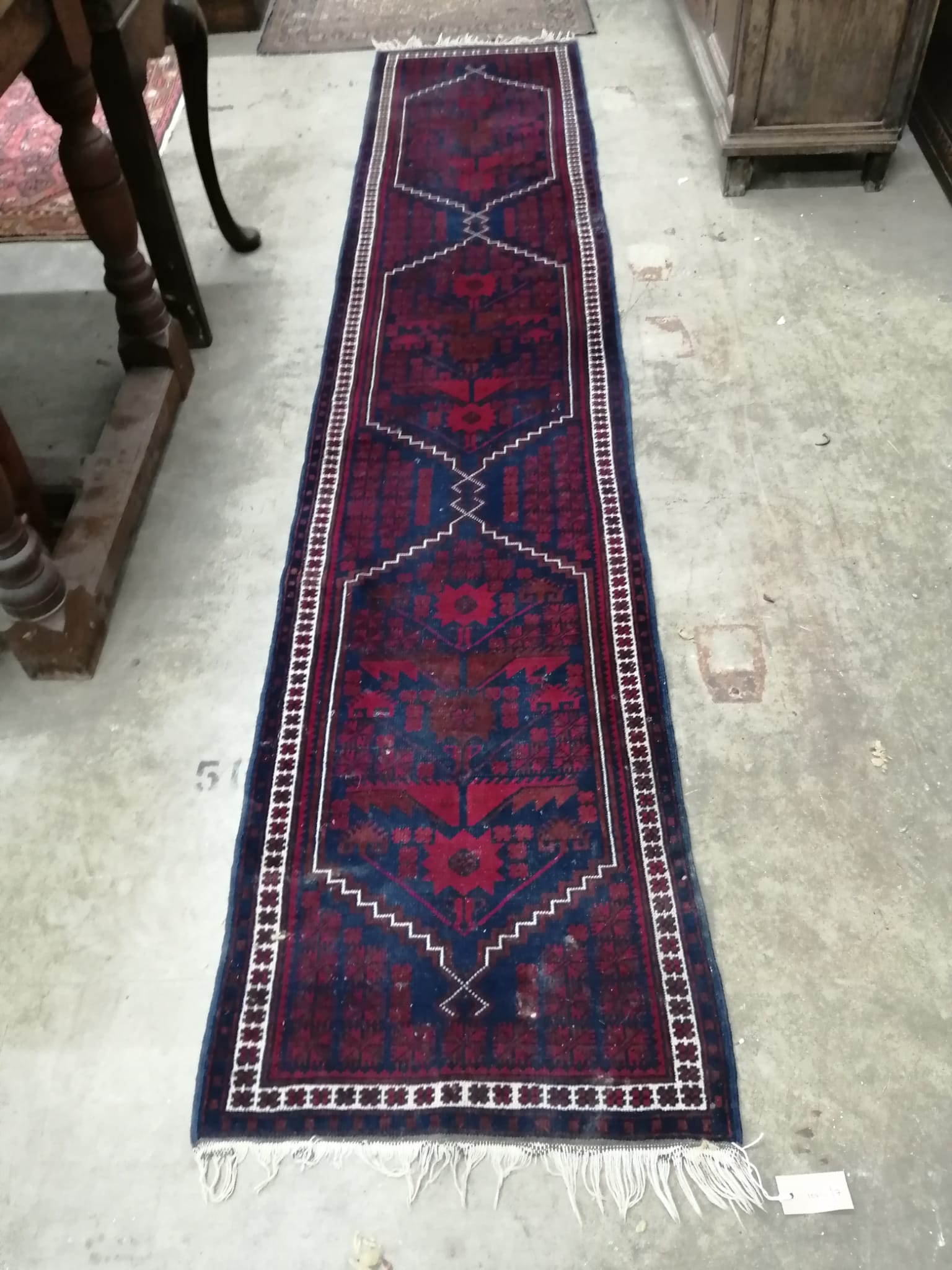 A Turkish blue ground runner, 290 x 59cm